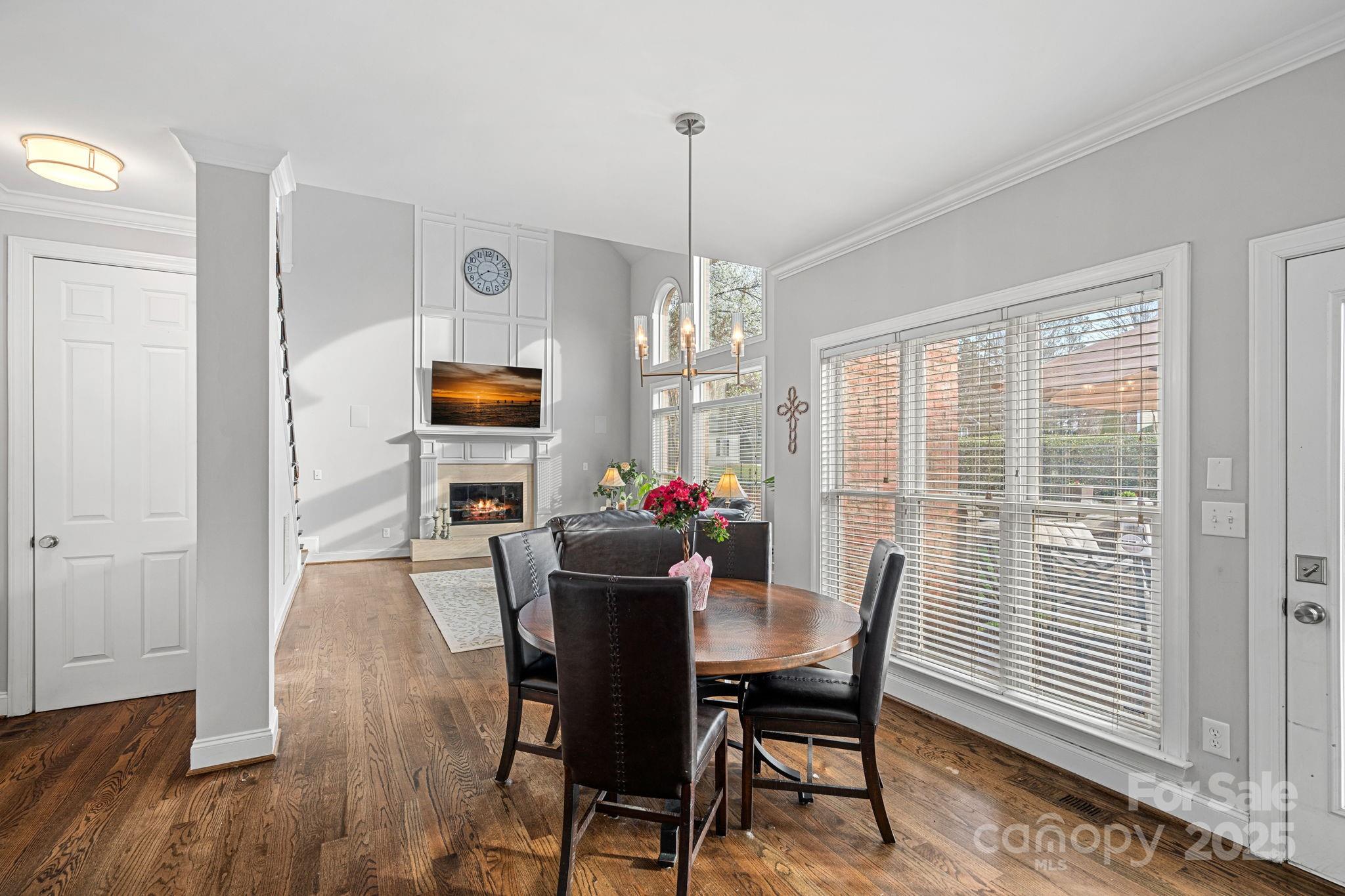 18334 Dembridge Drive Davidson, NC 28036 - Photo 10 of 35 a view of a dining room with furniture window and wooden floor