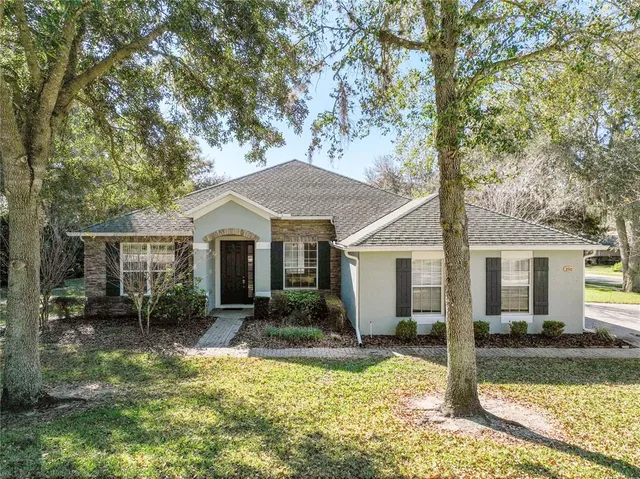 front view of a house with a yard
