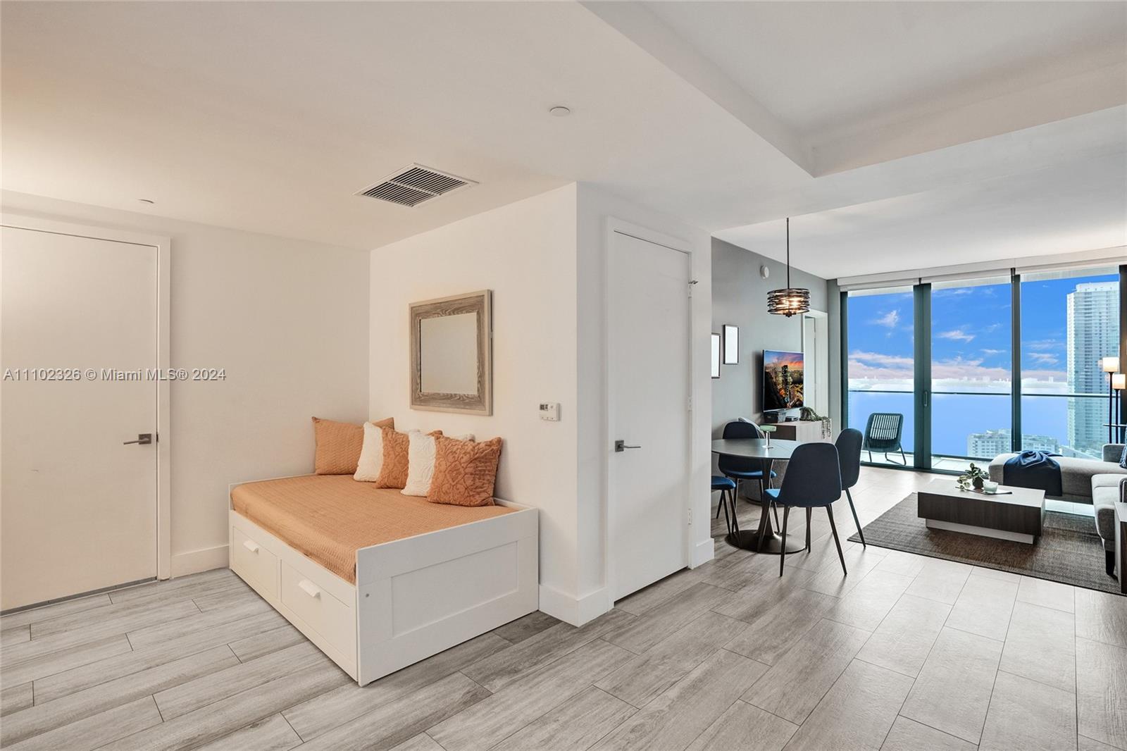 121 Northeast 34th Street, Unit 2906 Miami, FL 33137 - Photo 13 of 65 a living room with furniture and a large window