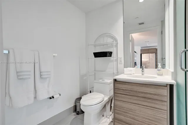 a en suite bathroom with a sink and a mirror