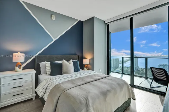 a bedroom with bed and a night stand