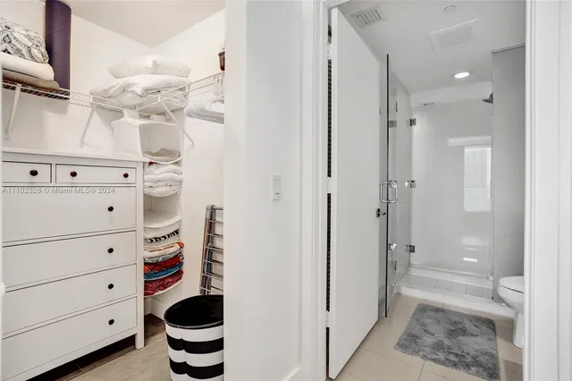 a view of a balcony with wooden floor and iron stairs