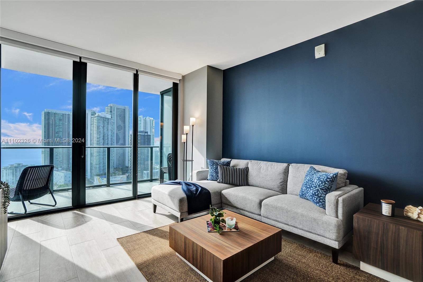 121 Northeast 34th Street, Unit 2906 Miami, FL 33137 - Photo 4 of 65 a living room with furniture and a large window