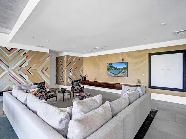 a view of a dining room with furniture and window