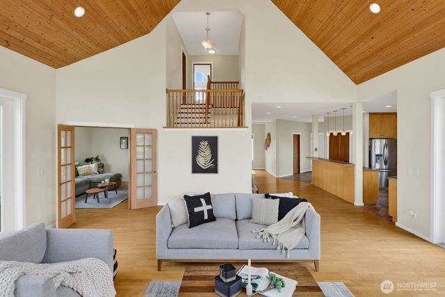 a view of living room with furniture and floor to ceiling windows