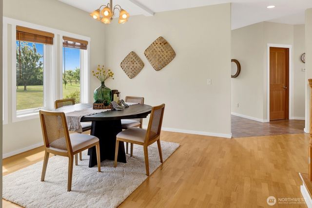 a kitchen with stainless steel appliances kitchen island granite countertop a refrigerator and a sink