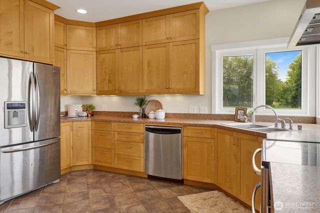 a kitchen with a sink stove and microwave