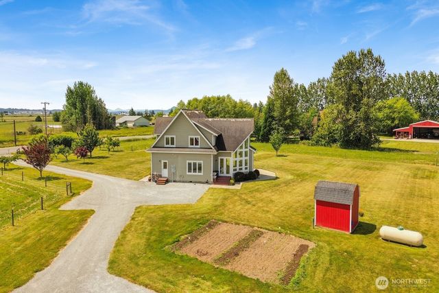 a living room with furniture potted plant and a window