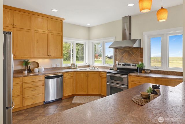 a kitchen with a stove and a microwave