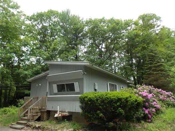 1864 West State Road Ashby, MA 01431 - Photo 1 of 12 a house that has a tree in front of it