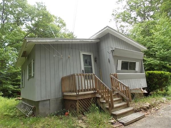 1864 West State Road Ashby, MA 01431 - Photo 2 of 12 a view of house with roof deck and furniture