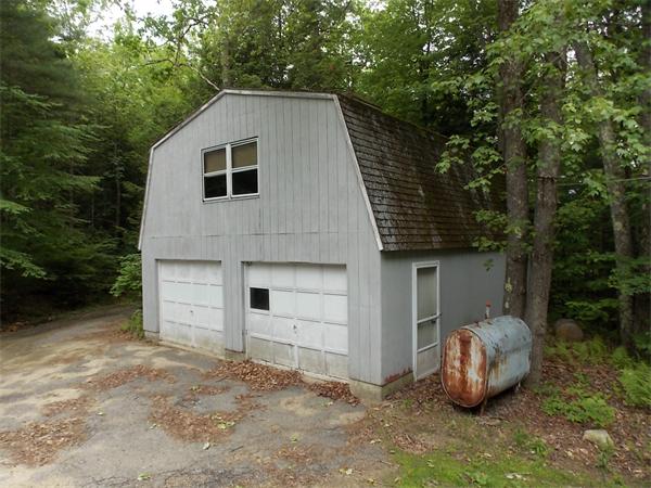 1864 West State Road Ashby, MA 01431 - Photo 3 of 12 a view of a small house with backyard