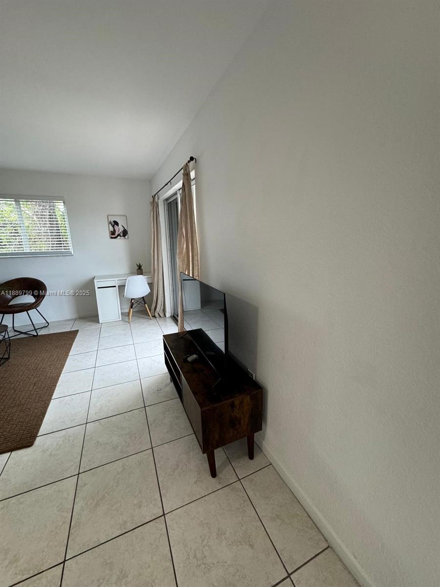 328 Northwest 12th Avenue, Unit 8 Miami, FL 33128 - Photo 4 of 15 a living room with furniture
