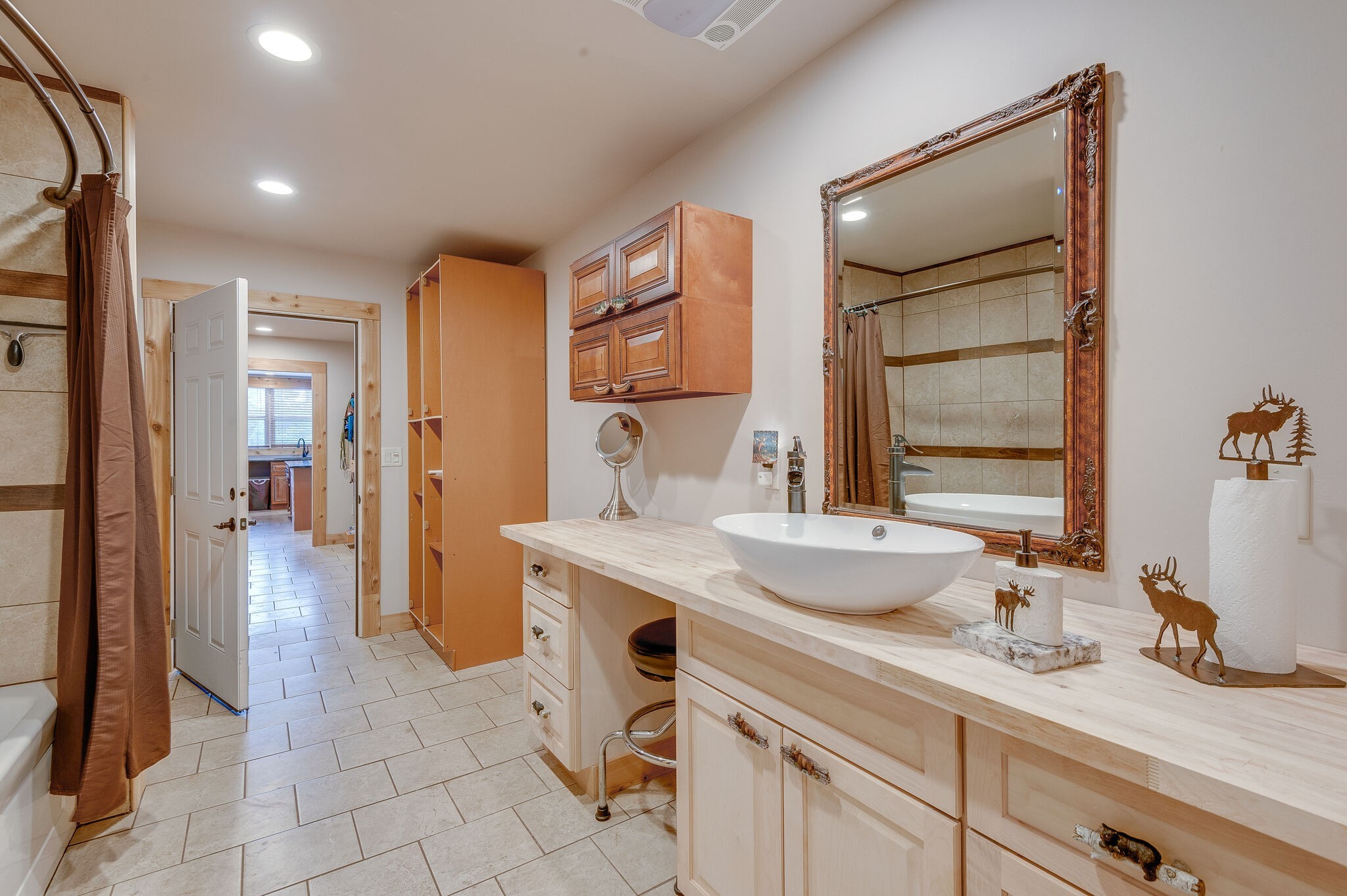 1372 Cliff Amos Road Spring Hill, TN 37174 - Photo 15 of 49 a spacious bathroom with a granite countertop sink a mirror and a shower