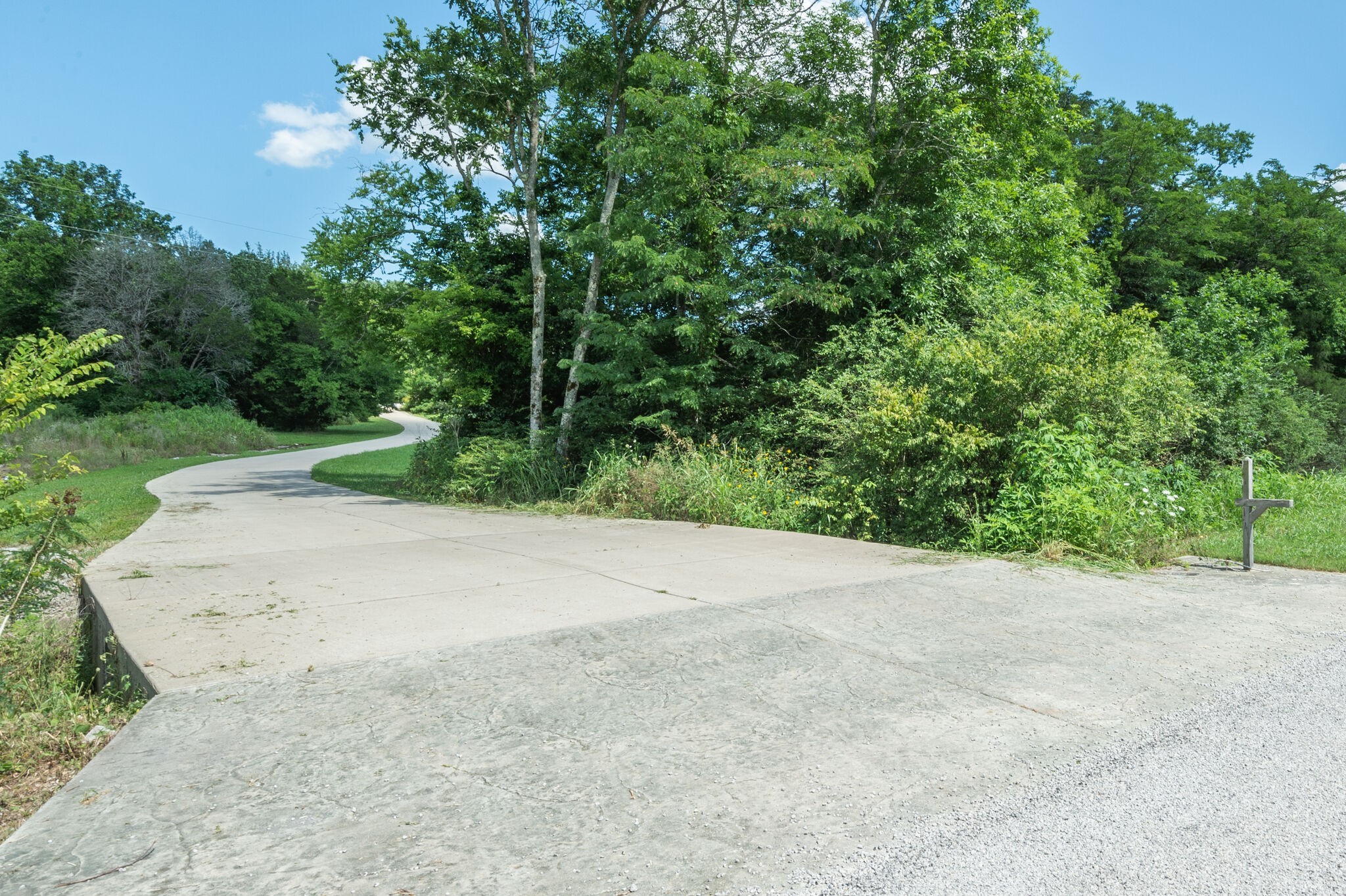 1372 Cliff Amos Road Spring Hill, TN 37174 - Photo 2 of 49 a view of a field with plants and trees