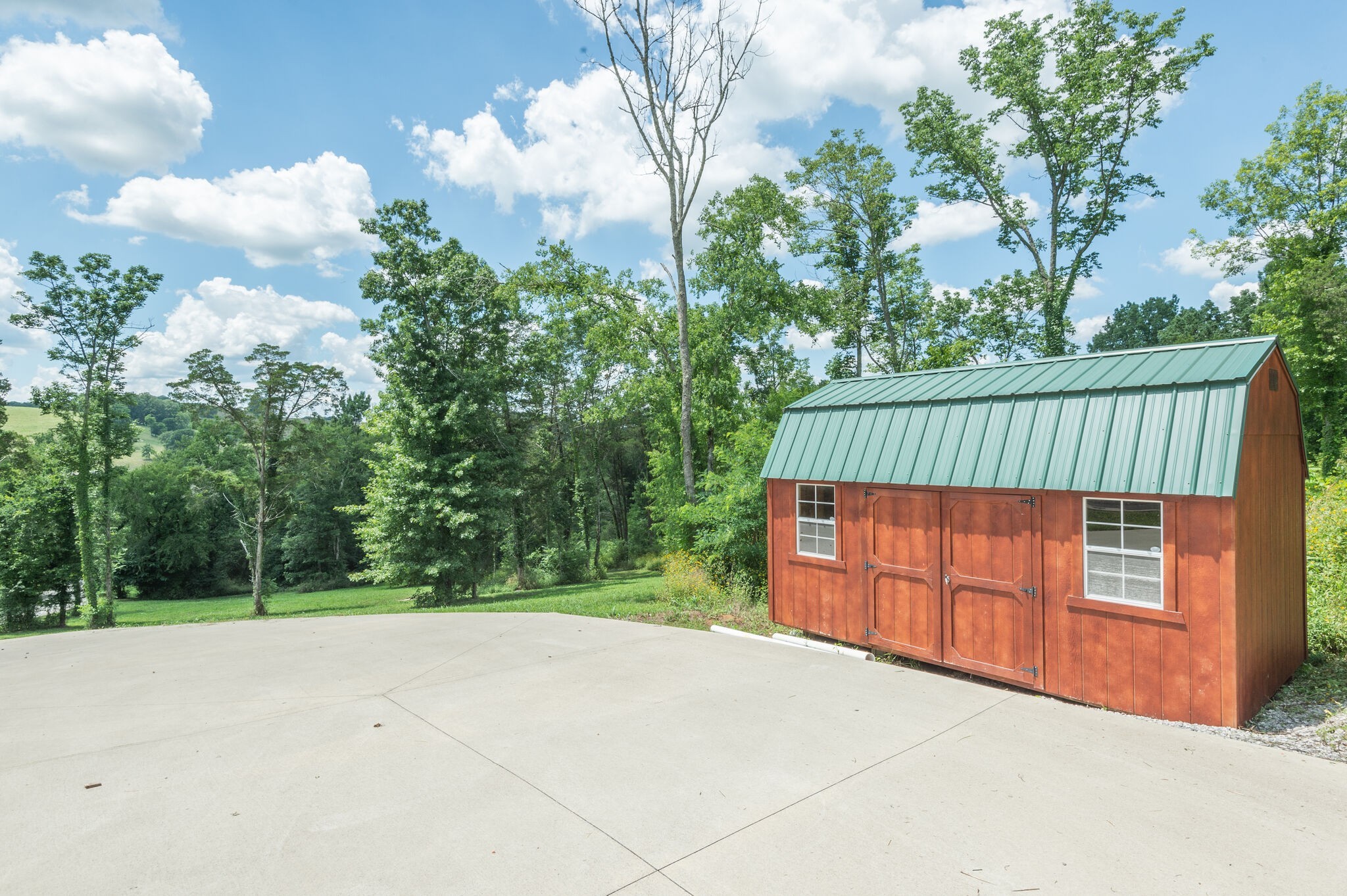 1372 Cliff Amos Road Spring Hill, TN 37174 - Photo 30 of 49 a backyard of a house with lots of green space