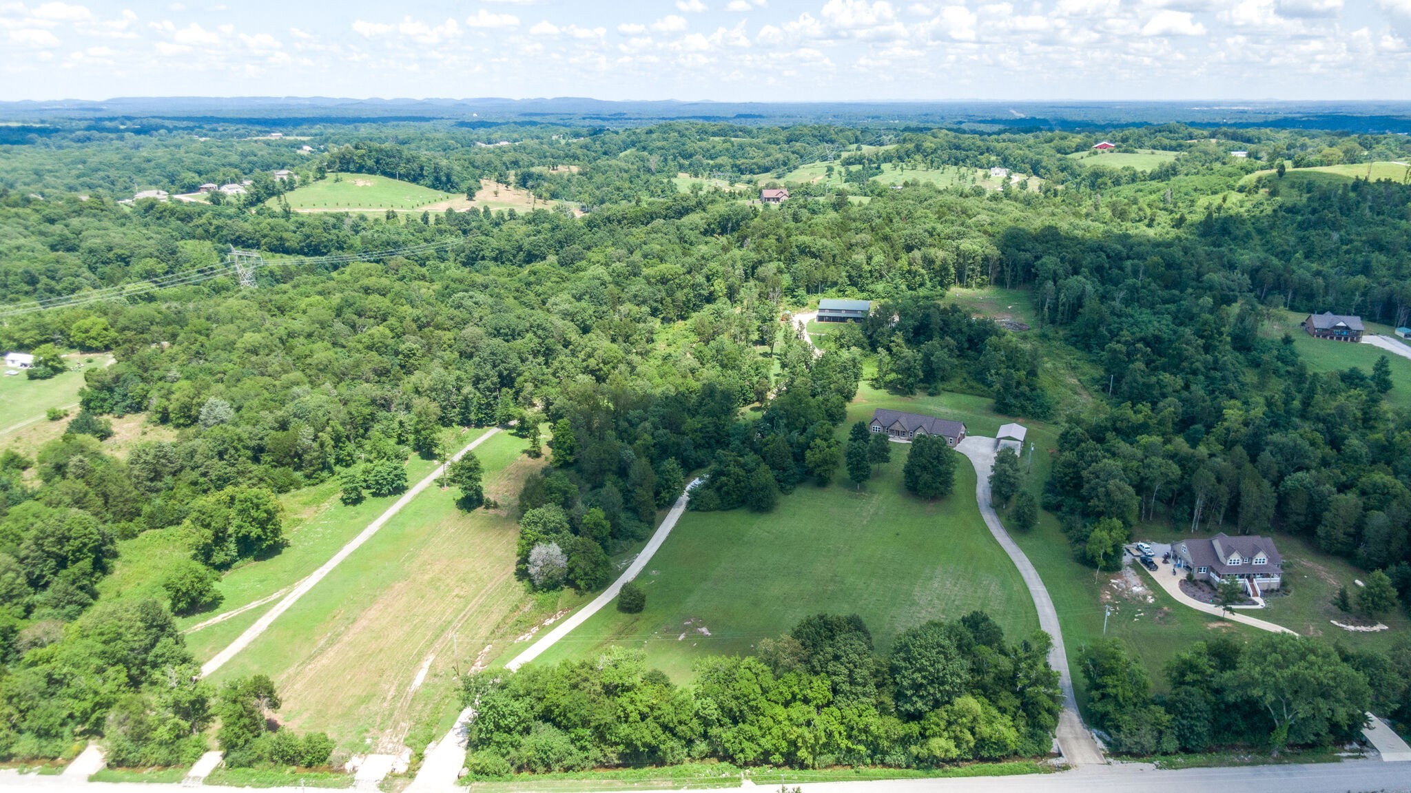 1372 Cliff Amos Road Spring Hill, TN 37174 - Photo 35 of 49 an aerial view of residential houses with outdoor space and trees