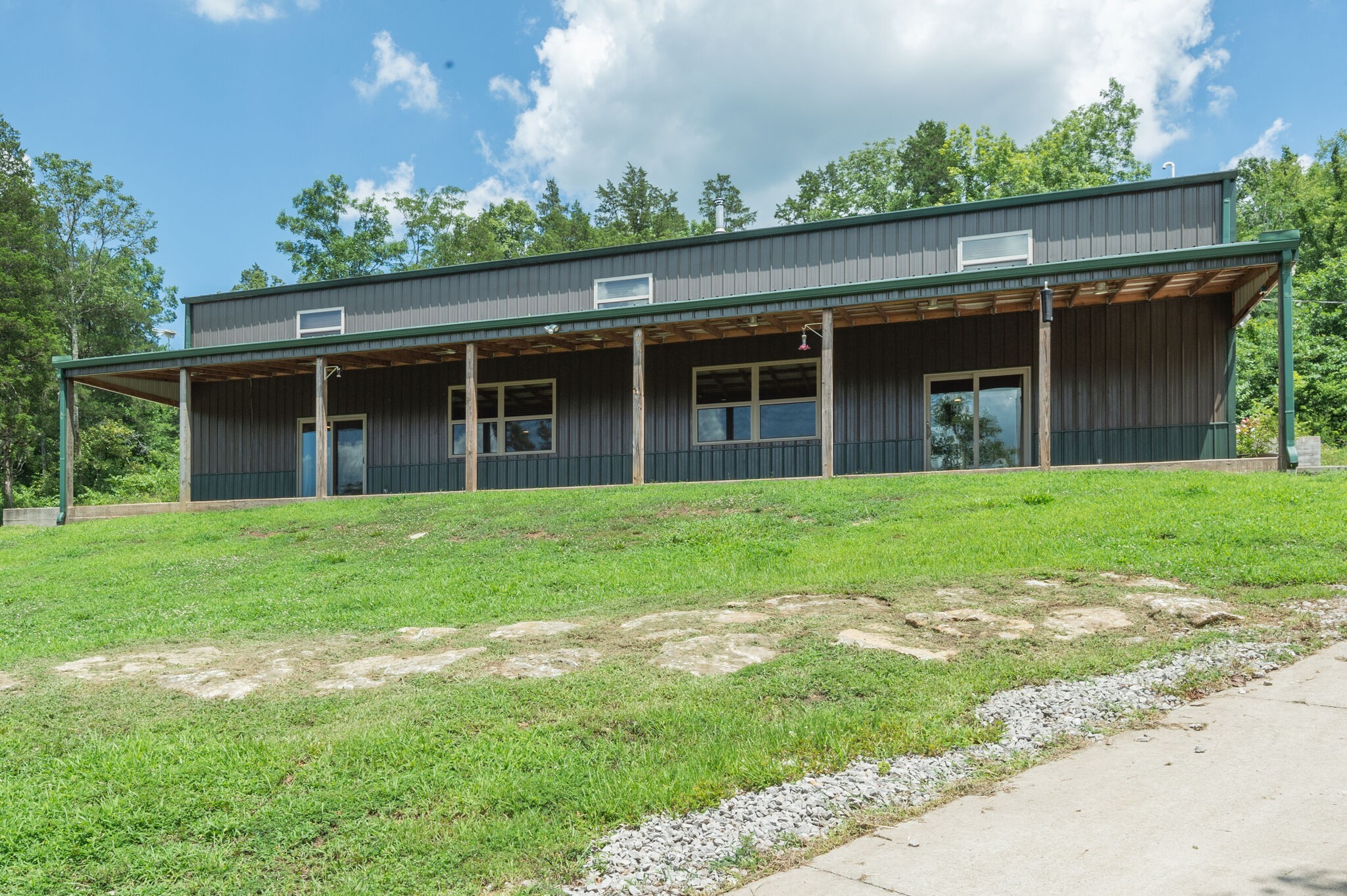 1372 Cliff Amos Road Spring Hill, TN 37174 - Photo 5 of 49 a view of a house that has a bunch of plants and trees