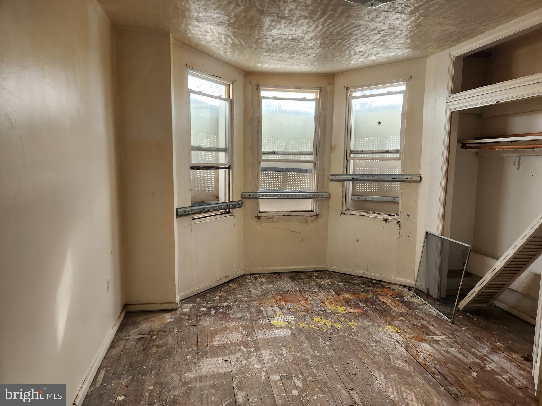 3424 West Belvedere Avenue Baltimore, MD 21215 - Photo 12 of 14 a view of empty room with wooden floor and window