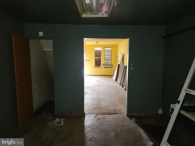 a view of hallway with wooden floor
