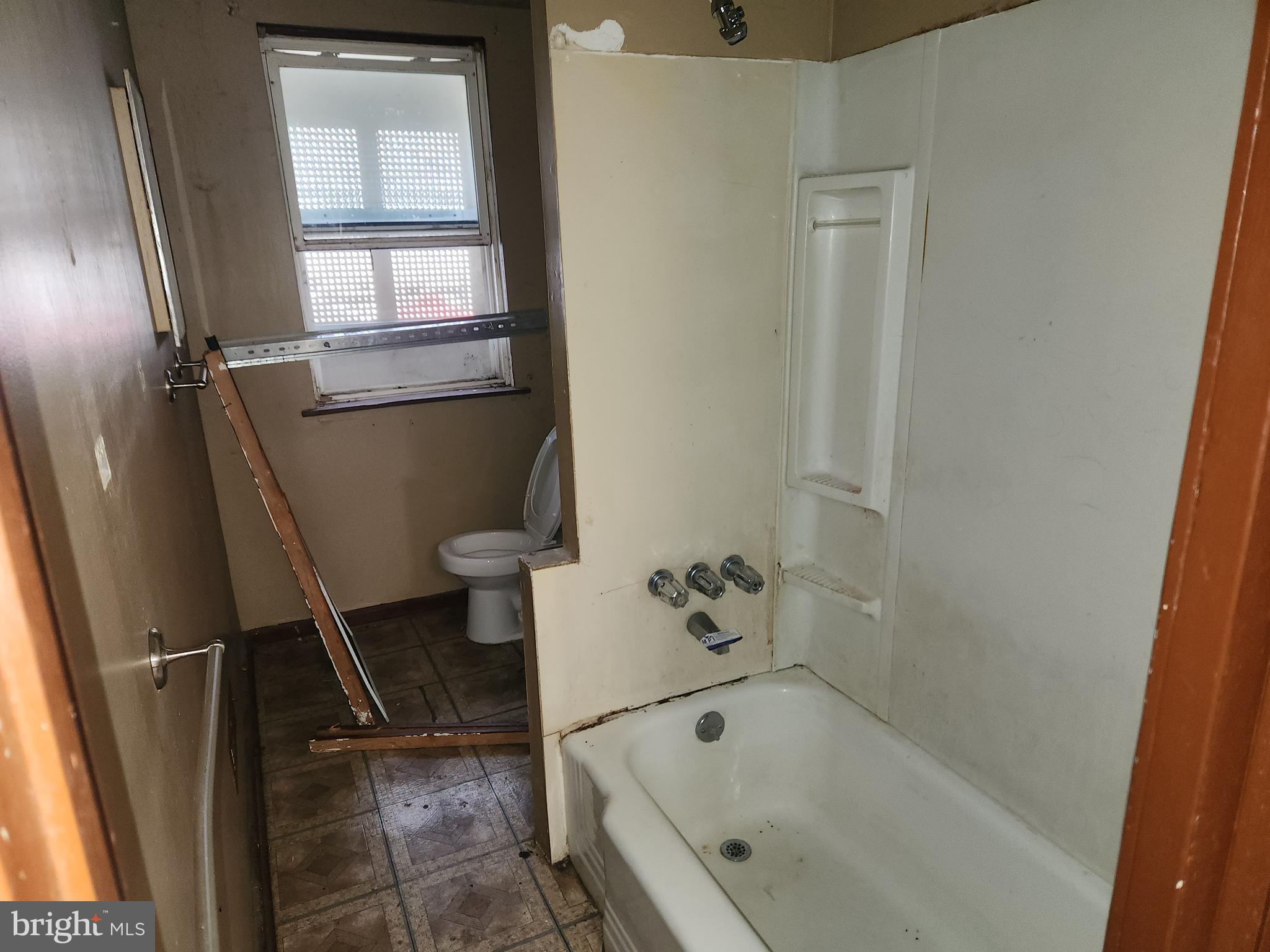 3424 West Belvedere Avenue Baltimore, MD 21215 - Photo 7 of 14 a bathroom with a bathtub and a shower
