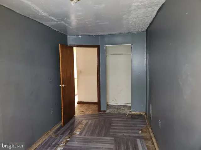 a view of room with wooden floor