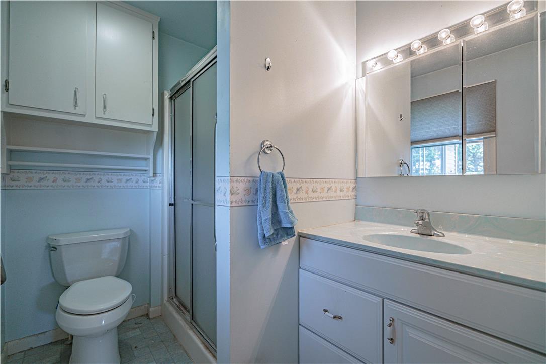 4815 Mill Road Schnecksville, PA 18078 - Photo 30 of 48 A compact bath features a combined shower and bathtub, with a practical vanity and integrated mirror storage.