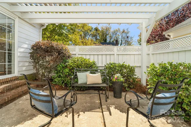 a view of a chairs and table in a patio