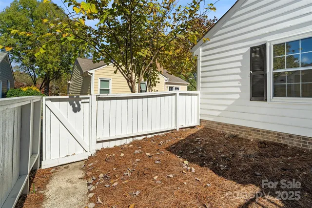 a view of a house with a small yard