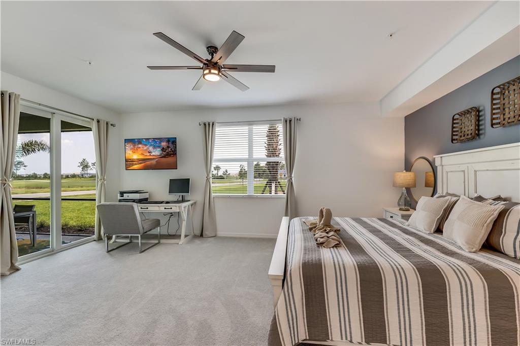 43330 Water Bird Way, Unit 6911 Punta Gorda, FL 33982 - Photo 11 of 17 Bedroom featuring carpet, ceiling fan, and access to outside