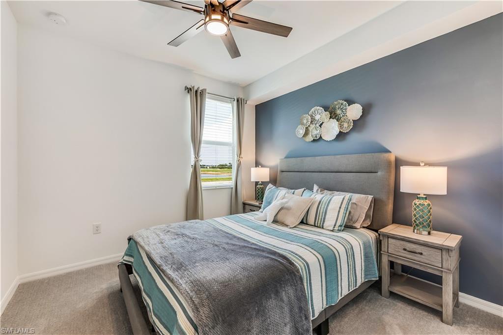 43330 Water Bird Way, Unit 6911 Punta Gorda, FL 33982 - Photo 14 of 17 Bedroom featuring carpet and ceiling fan