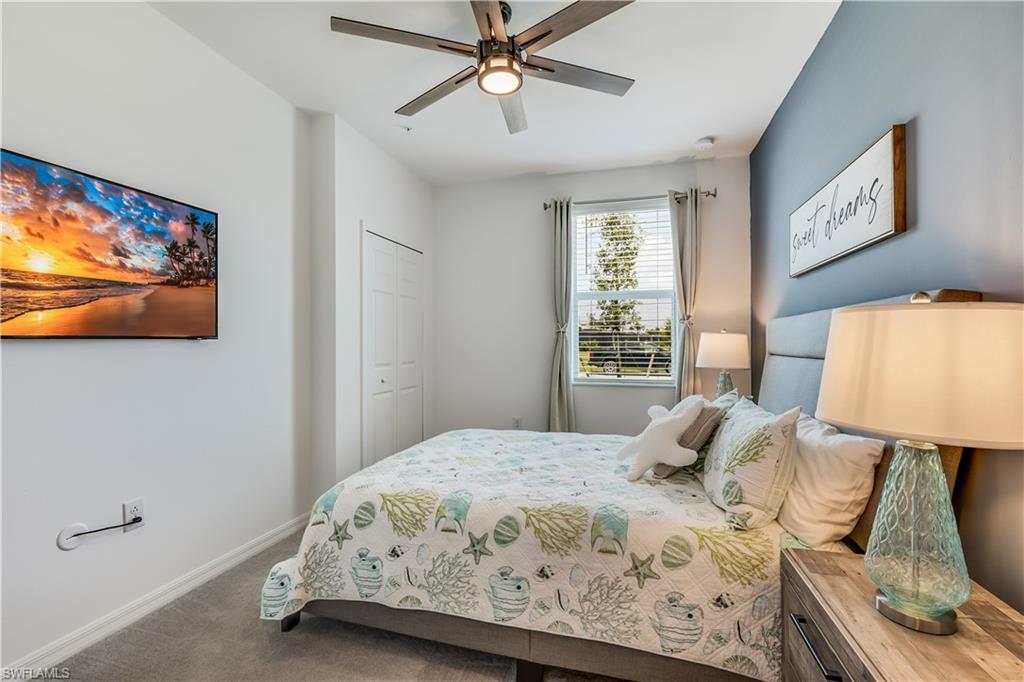 43330 Water Bird Way, Unit 6911 Punta Gorda, FL 33982 - Photo 15 of 17 Carpeted bedroom with a closet and ceiling fan