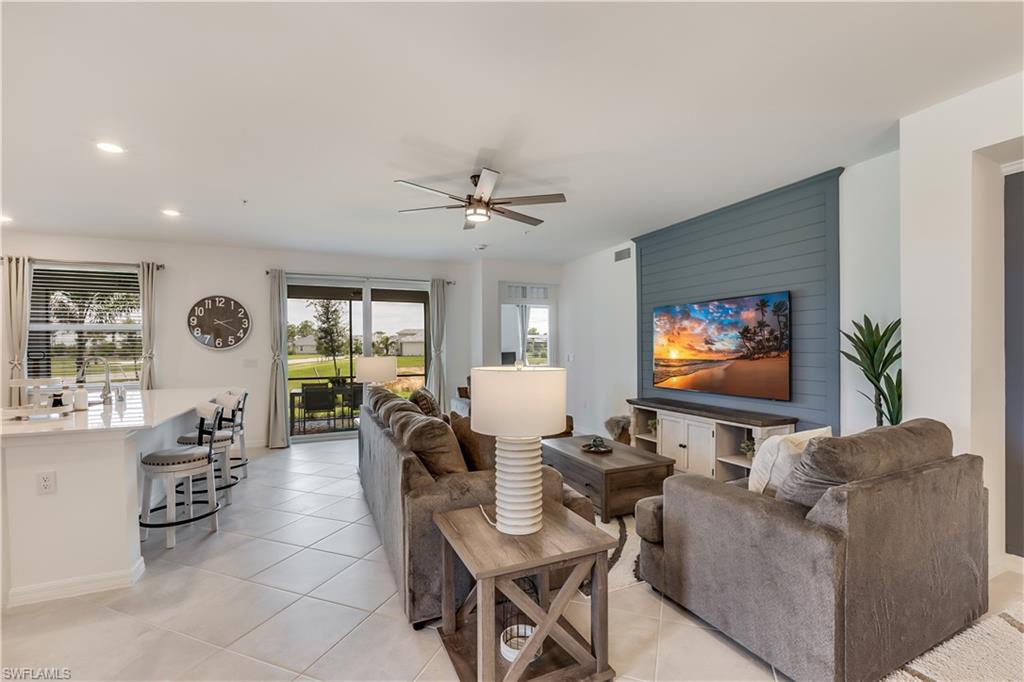 43330 Water Bird Way, Unit 6911 Punta Gorda, FL 33982 - Photo 5 of 17 Living room featuring sink, ceiling fan, and light tile floors