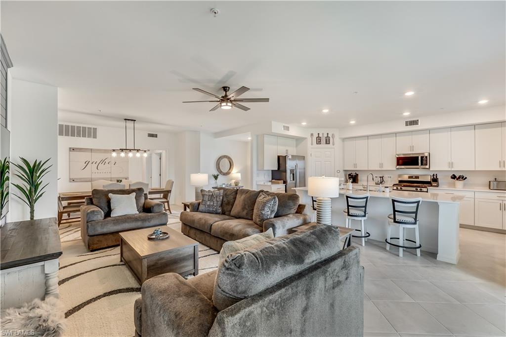 43330 Water Bird Way, Unit 6911 Punta Gorda, FL 33982 - Photo 9 of 17 Living room with sink, light tile flooring, and ceiling fan