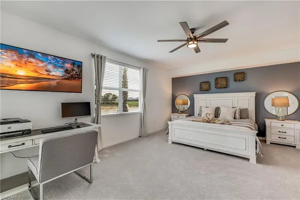 a bedroom with a bed and a desk