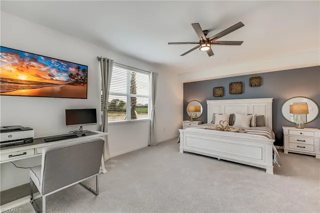 a bedroom with a bed and a desk