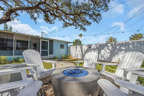 a view of a house with a small yard and plants