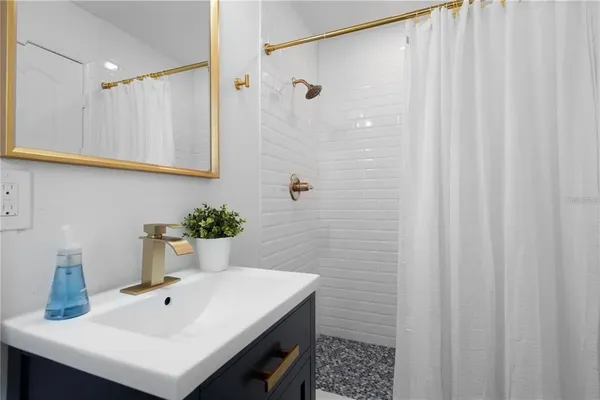 a living room with furniture fireplace and flat screen tv