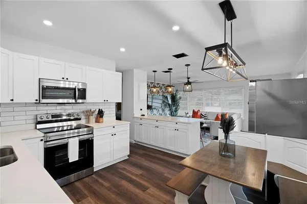 a bedroom with a bed and lamp