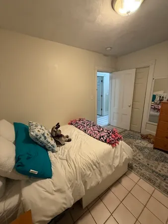 a bedroom with a bed and a cabinets