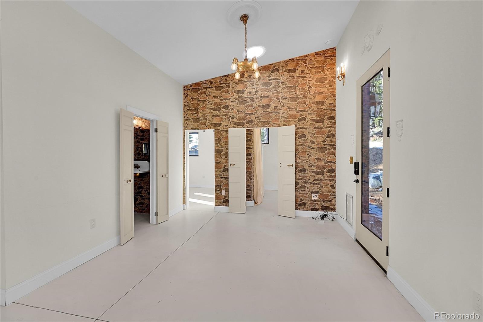 148 Ridge Lane Bailey, CO 80421 - Photo 11 of 25 wooden floor in an empty room with a window