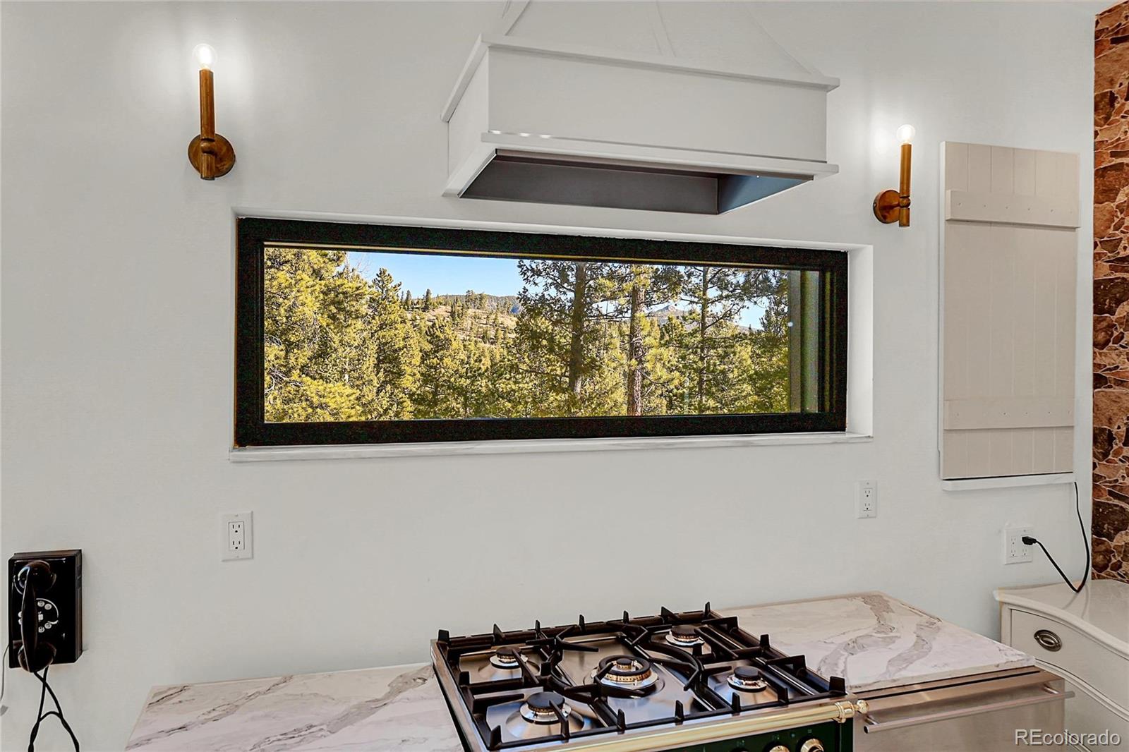 148 Ridge Lane Bailey, CO 80421 - Photo 13 of 25 a kitchen with a stove and a window