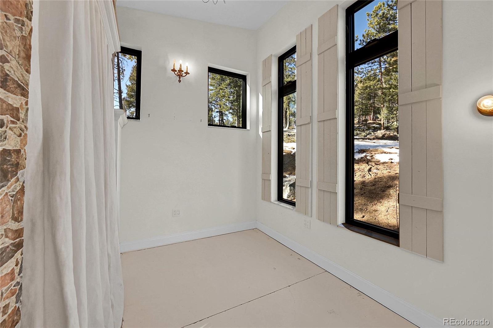 148 Ridge Lane Bailey, CO 80421 - Photo 15 of 25 an empty room with windows