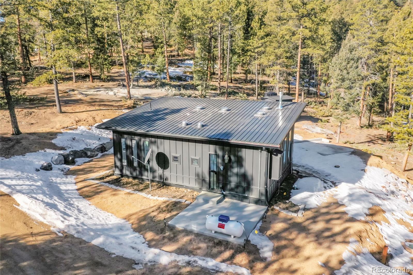 148 Ridge Lane Bailey, CO 80421 - Photo 20 of 25 a terrace with outdoor seating and covered with water