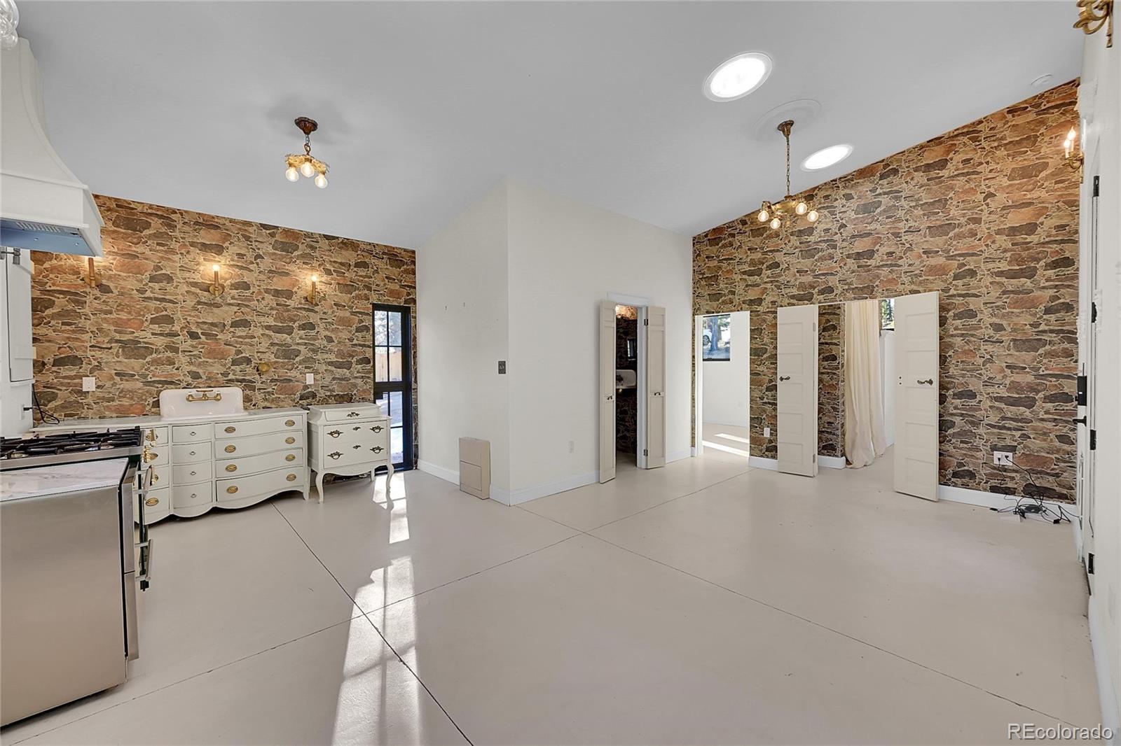 148 Ridge Lane Bailey, CO 80421 - Photo 7 of 25 a view of an empty room with a fireplace