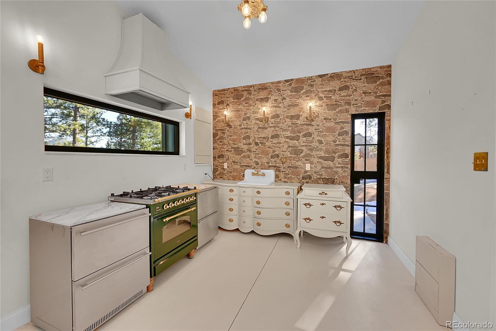 148 Ridge Lane Bailey, CO 80421 - Photo 8 of 25 a kitchen with white cabinets and window