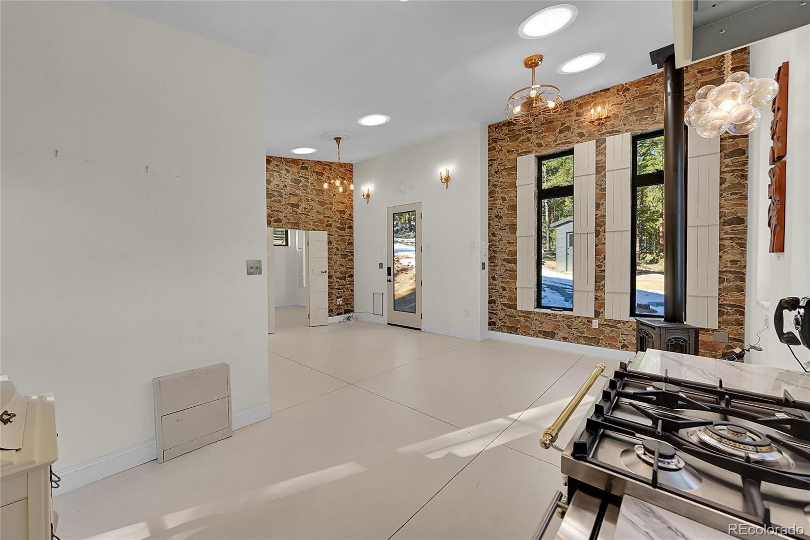 148 Ridge Lane Bailey, CO 80421 - Photo 10 of 25 a kitchen with a table and chairs
