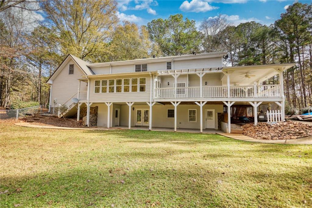 2491 Reids Ferry Road Buckhead, GA 30625 - Photo 3 of 9 a view of a house with a yard and large trees
