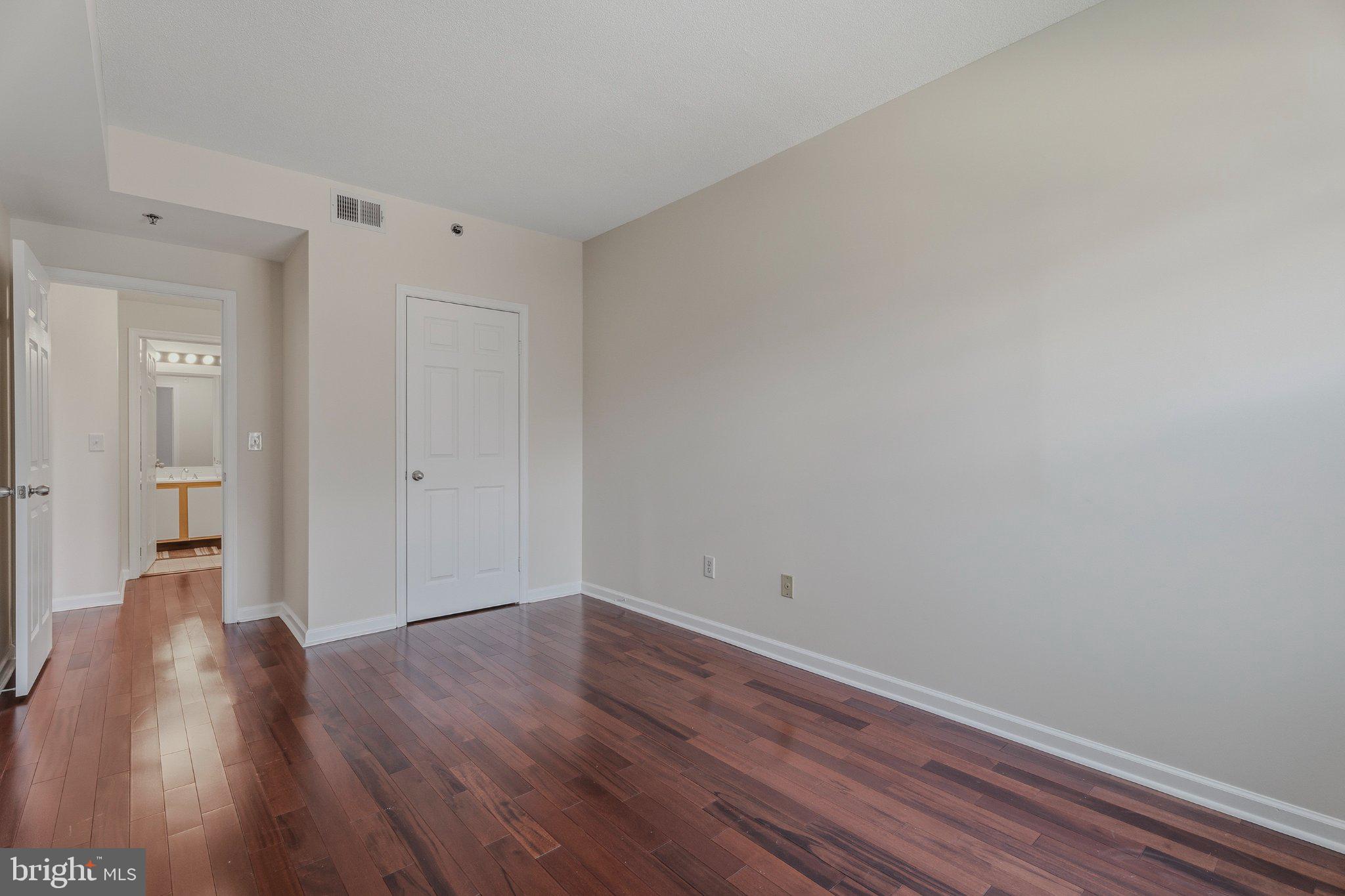 960 Fell Street, Unit 308 Baltimore, MD 21231 - Photo 19 of 38 Spacious room with warm wood floors.