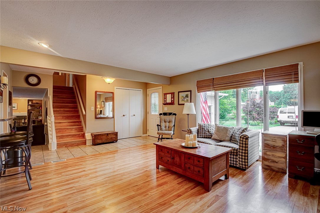 31950 Cannon Road Solon, OH 44139 - Photo 10 of 33 Living room with a textured ceiling and light hardwood floors